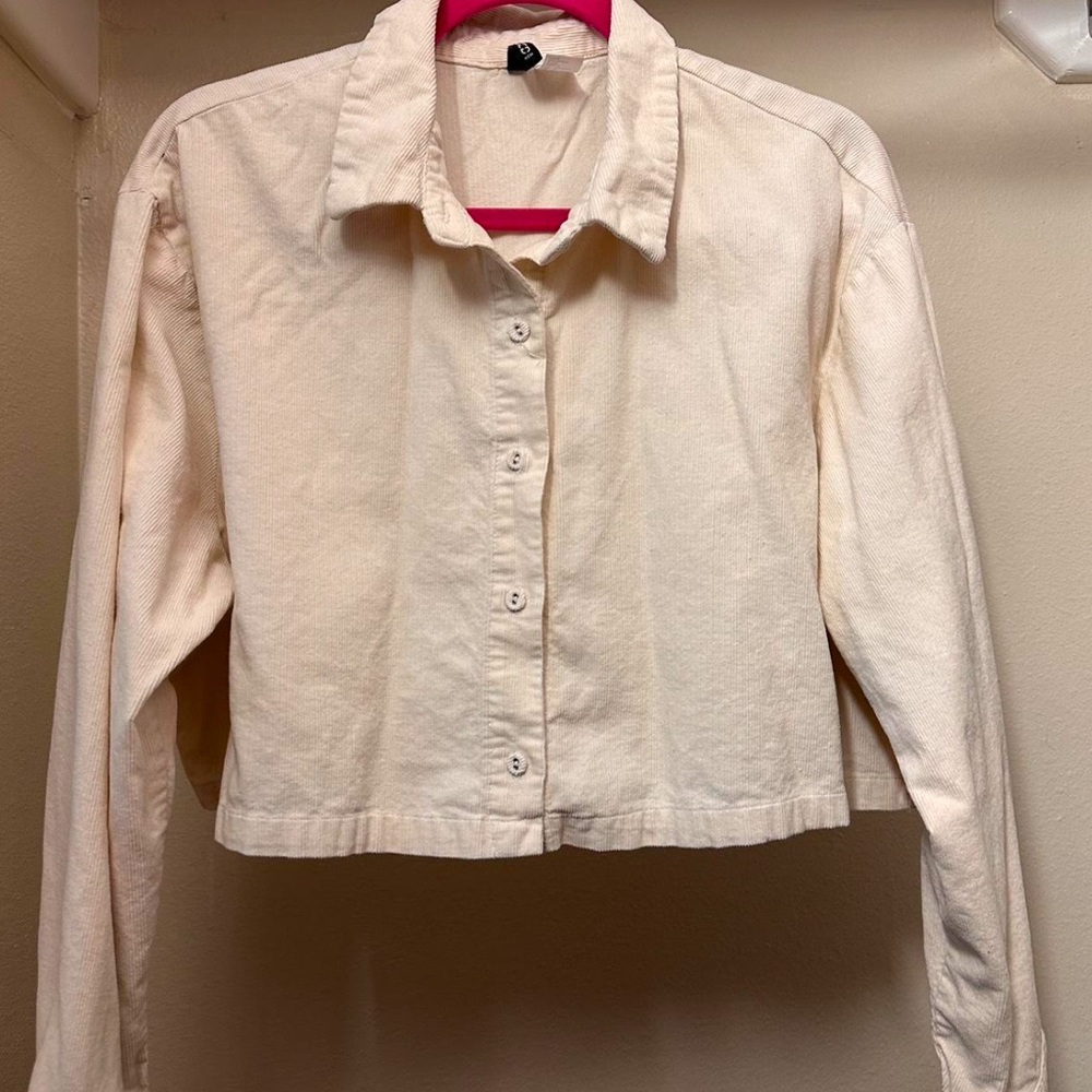 Cream buttoned up top